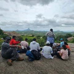 A group taking a break and enjoying the view during the Nijagal Betta trek. My one-day treks are beginner friendly and focus on enjoying nature.