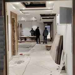 A view from the early stages of construction, showing the raw space and the initial framework taking shape. I am hands-on throughout this process to ensure every element is built to specification.