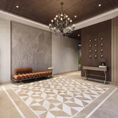 The foyer of this upcoming villa makes a grand statement with a geometric marble floor inlay, a dark wood ceiling, and a classical chandelier. A textured art wall and modern bench complete the look.