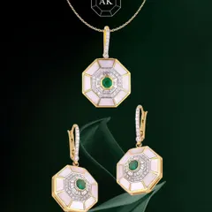 Geometric, glamorous, and gorgeous. This pendant and earring set from our Eternal Collection features a bold octagon design with natural emeralds, diamonds, and mother-of-pearl in 18K gold. It’s minimal, modern, and makes a statement without being loud.