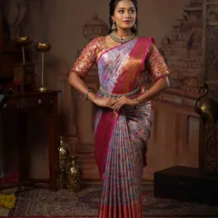 This is the result of a wonderful team effort. I draped this multi-color silk saree on Ramya, creating a graceful look with perfectly defined pleats that complement her makeup and hairstyle.