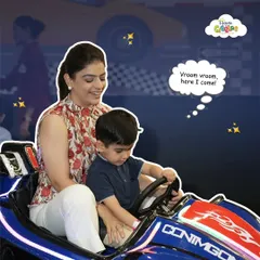 Vroom vroom, here I come! A mother and son share a special moment, ready to race and bump their way through our exciting track. It's the perfect bonding activity.