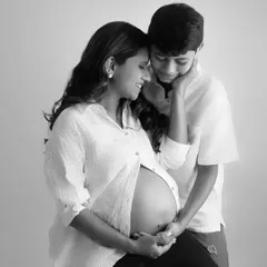 A tender black and white portrait of an expecting mother and her son. This classic edit highlights the emotional bond and anticipation of welcoming a new family member.