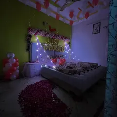 The romantic ambiance of the 'Just Married' room at night, with the fairy lights creating a soft, dreamy glow.