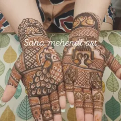 This design showcases different styles of peacock and swan motifs, from bold figures on the palm to delicate ones on the wrist.