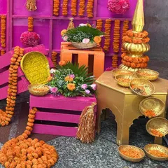 Traditional elements are the soul of a Haldi ceremony. I used colorful crates, brass vessels, and garlands of marigolds to create this vibrant corner for guests to participate in the rituals.