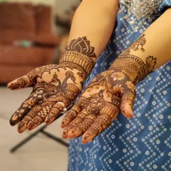 A gorgeous design for the bridesmaids, featuring peacocks and lotuses. It's detailed enough to feel special but distinct from the bridal mehendi.