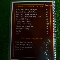 This section of our menu lists our special chutneys like King Chilli with Ngari or Axone, and our variety of organic rice, including Black Rice and Sticky Rice.