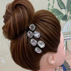 Excellent work by one of my students during a hairstyle practice session. This clean, high bun is a classic and versatile updo.