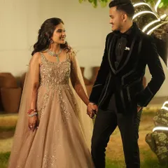 A suit made to stand out. This black velvet tuxedo features bold satin trim, creating a powerful and memorable look for a wedding reception.