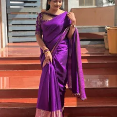 A full view of a model wearing a simple purple saree paired with my intricately embroidered designer blouse, showing how a statement piece can transform a look.