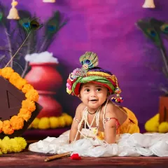 A joyful baby Krishna in our colorful and festive Janmashtami themed set.