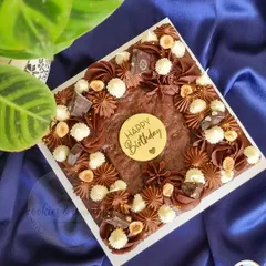 Another one of my signature brownie cakes. The combination of a fudgy brownie base with creamy chocolate frosting and crunchy hazelnuts is a guaranteed crowd-pleaser.
