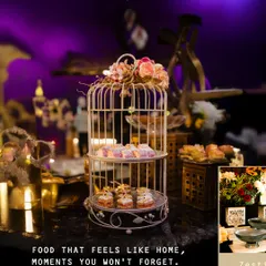 We plate joy every step of the way. This beautiful dessert display in a birdcage stand features a variety of Indian sweets, perfect for weddings and birthdays.