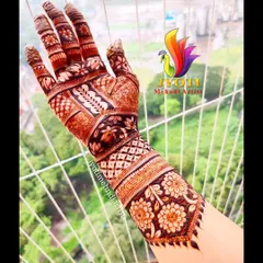 This full-hand Indian henna design showcases a beautiful floral cuff and intricate patterns covering the entire hand, perfect for a bride or a special occasion.