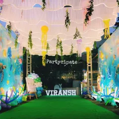I love transforming a space completely. For this 'Under the Sea' party, we created an immersive underwater walkway with flowing ceiling drapes, hanging jellyfish, and sea-themed decor to make guests feel like they were diving into the ocean.