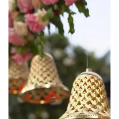 These intricate, latticed brass bells are a versatile decorative element I love to use. Hung from floral arrangements or as part of a larger installation, they add a traditional charm and a sense of sacred sound to the atmosphere.