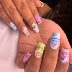 Cuteness overload! This playful set features different adorable cartoon characters hand-painted on each nail against a pastel matte background. Perfect for when you want your nails to make you smile.
