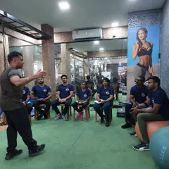 A classroom session in progress. Here, I am explaining the theoretical principles of program design to a group of aspiring trainers. A strong scientific foundation is what separates a good trainer from a great one.
