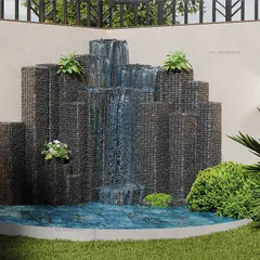 A close-up of a custom water feature we designed for a backyard. The cascading waterfall creates a soothing sound and a beautiful focal point for the garden.