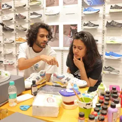 A big part of live art is the conversation. Here I am at the New Balance event, brainstorming ideas with a customer for his custom sneaker design. We work together to make sure the final piece is exactly what he envisions.