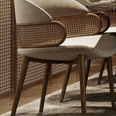 I pay close attention to detail, like in this bespoke dining chair. It combines a modern upholstered seat with a beautifully curved, hand-woven rattan backrest, all supported by a sturdy, elegant teak wood frame for a light, airy feel.