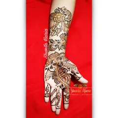 A classic Arabic-style floral bel (vine). This design flows gracefully from the fingers up the arm, featuring a mix of flowers and leaves for a timeless and elegant look.