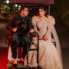 A fun and quirky moment as the couple, Sahas and Rozy, share a ride on a golf cart during their sangeet night. It's these unique, personal touches that make a wedding story special.