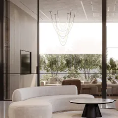 This waiting area for the Trident Experience Centre creates an inviting space through large windows and clean lines. Soft, natural light and furniture with subtle curves create a calm, sophisticated, and welcoming feel for visitors.