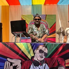 Me behind the decks at a vibrant, colorful Mehendi party. Daytime events have a special kind of energy, and I love matching it with a fun, upbeat playlist of Bollywood and retro hits.