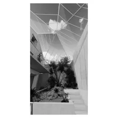 This view into the sunken court shows how the space connects visually with the upper-level living areas, creating a multi-layered and interactive home environment.