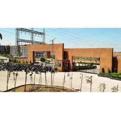 The main entrance gate of Sage University, designed with a monumental scale that signals the entry to a significant place of learning.