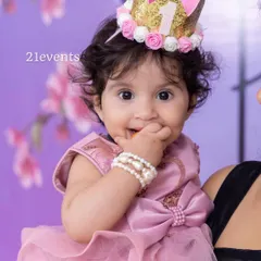 A close-up of the birthday girl, looking adorable with her custom crown.