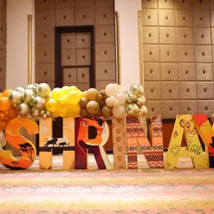 Custom-designed, large-scale letters spelling out the birthday boy's name, "SHRINAY," for his Lion King themed party. Each letter is decorated with unique patterns and scenes from the movie, creating a perfect photo opportunity.