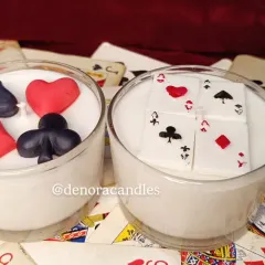 Perfect for Diwali card parties, my poker-themed candles are a guaranteed conversation starter. This set features two glass candles, one with card suit embeds and the other with a royal flush design.