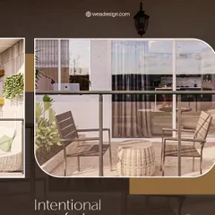 This shot highlights the intentional comfort of the balcony design, with a mix of seating and a small wicker table.