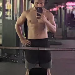 Another angle showcasing the hard-earned physique after months of dedication. Our programs are designed to help you achieve the look you've been working for.