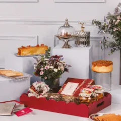 The Imperial Hamper, a grand gesture for Diwali. This luxurious red tray is filled with our finest desserts, flowers, and candles, perfect for spreading festive joy.