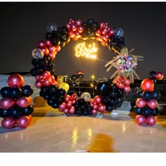 This full shot shows the complete bachelorette party backdrop, including the circular arch and matching balloon pillars, perfect for group photos.