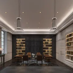 Another view of the Chief Justice of India's office, showcasing the bespoke, back-lit bookshelves designed to house an extensive law collection. The symmetrical design and refined detailing create a sense of order and prestige.
