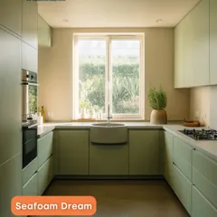 This kitchen is a breath of fresh air, designed in a calming seafoam green. The U-shaped layout maximizes counter space, while the minimalist, handleless cabinets create a clean and uncluttered look. It’s a perfect example of how neutral tones can create a serene and timeless heart of the home.