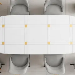 A top-down view of the dining table, showing the clean lines and geometric brass inlays on the tabletop. This perspective highlights the balance and symmetry in the design.