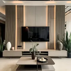 A sophisticated TV wall unit featuring vertical wooden slats and integrated LED strip lighting. The low-profile console keeps the look clean and uncluttered, perfect for a modern living room.