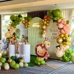 For Ekaksh's 'Wild One' party, I designed a backdrop with soft green tones and a large balloon arch. The cute lion and elephant cutouts made the setup feel extra special for a first birthday.