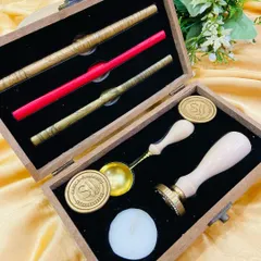 Our personalised wax seal stamp kit in its elegant wooden box. This set includes everything you need to add a touch of old-world charm to your correspondence.