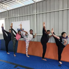 Look at that flexibility. We work together on skills like standing splits, and it's amazing to see the kids support each other and celebrate their progress as a team.