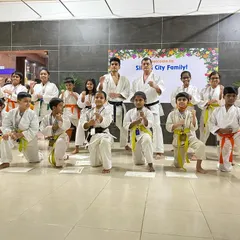 Our medal winners from the Silicon City dojo strike a powerful kamae (ready stance) pose. They fought with great spirit and represented our dojo with pride.