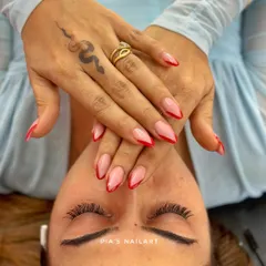 A classic red French tip is always a power move. Here we've paired it with fresh, natural-looking lash extensions for a complete glam look.