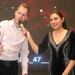 Making sure everyone's voice is heard is key to an inclusive event. I enjoy moving through the audience and passing the mic, giving guests a chance to share a story or participate directly, which is especially important for engaging mixed Indian and international crowds.
