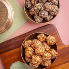 Laddoos that do more than just taste good. This image shows two types of my wholesome laddoos, one with sesame and another with mixed nuts, both packed with nourishment.